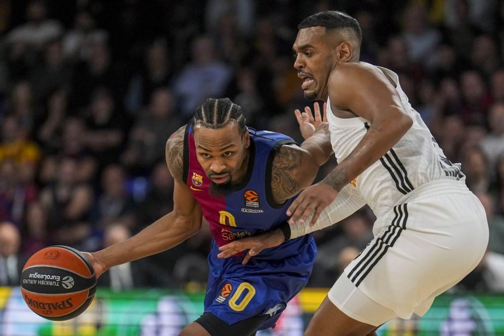 Košarkaš Real Madrida Ksavijer Rejtan-Majs protiv Kevina Pantera.