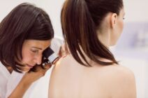 dermatologist-examining-skin-patient-with-dermatoscope copy.jpg