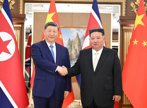 Si Đinping i Kim Džong Un