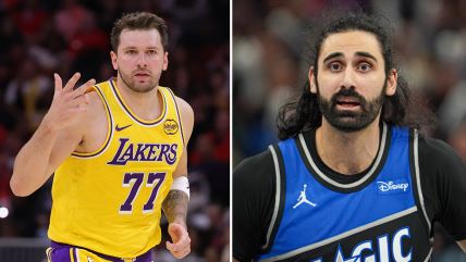 Luka Dončić pokazuje tri prsta, a Goga Bitadze u dresu Orlanda s kosom.