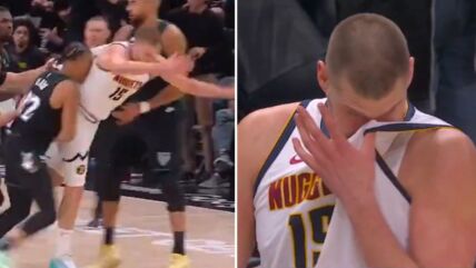Nikola Jokić pada u duelu protiv igrača Minesote