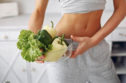 beautiful-sporty-woman-kitchen-with-vegetables.jpg