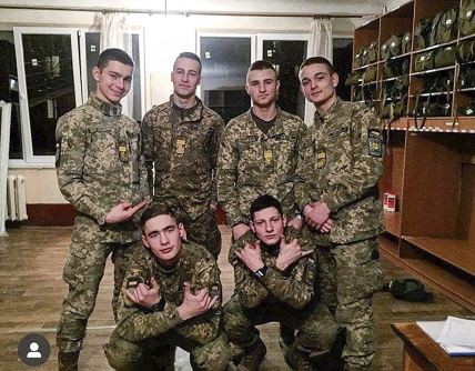 This undated photo provided by Ukraine's Police Saturday, Sept. 26, 2020 shows cadets of a military aviation school killed in an AN-26 military plane crash, pose for photo. AN-26 military plane crashed in the town of Chuhuiv close to Kharkiv late Friday Sept. 25, 2020, killing 26 of the 27 people aboard. The plane, a twin-turboprop Antonov-26 belonging to the Ukrainian air force, was carrying a crew of seven and 20 cadets of a military aviation school when it crashed and burst into flames while coming in for landing at the airport in Chuhuiv, about 400 kilometers (250 miles) east of the capital Kyiv. (Ukrainian Police Press Office via AP)