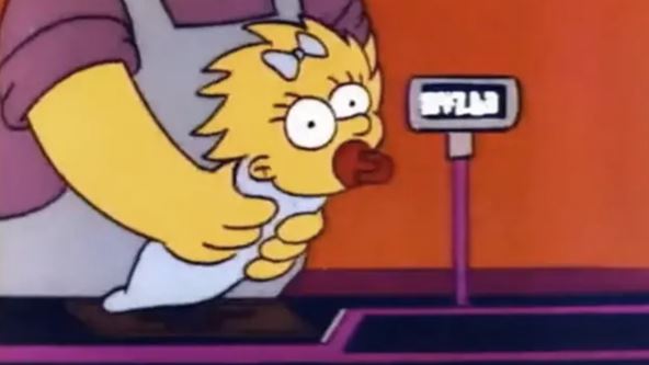 beba Megi iz Simpsonovih skenira se na kasi