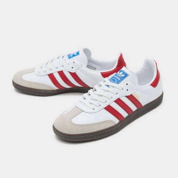 Adidas Samba sa crvenim detaljima.