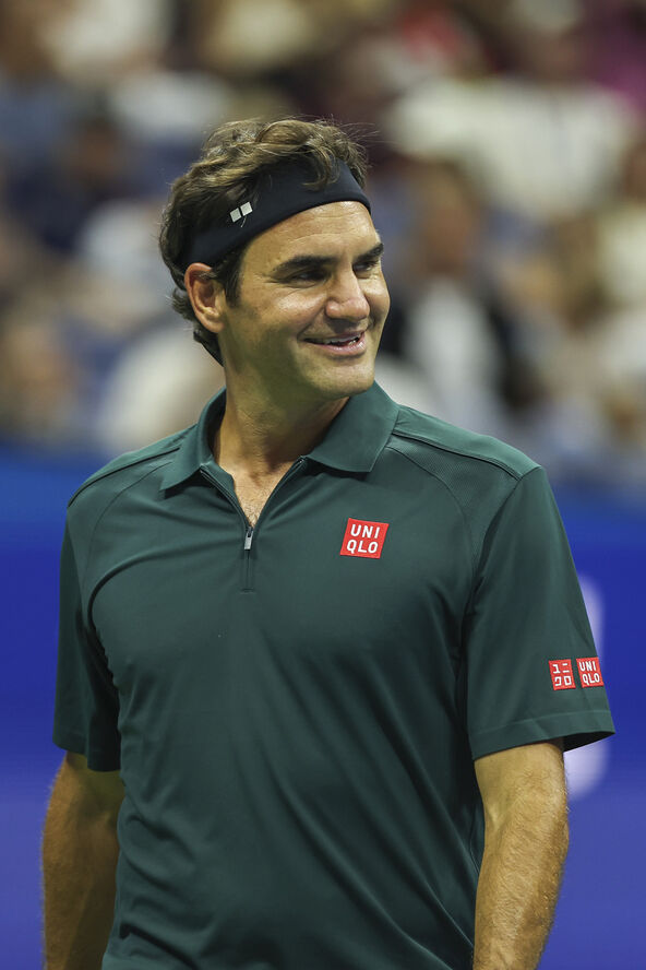 Rodžer Federer u zelenoj majici.